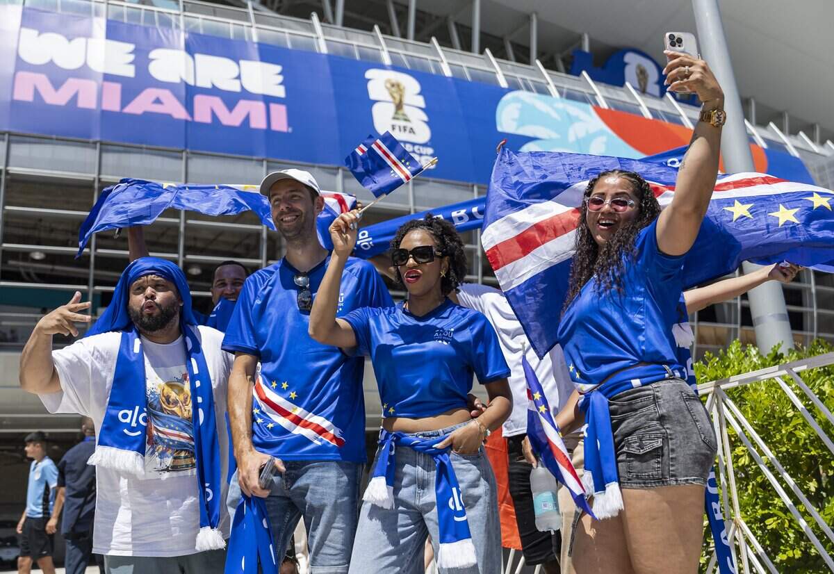 Djamila Dossantos, 28, center, a Cape Verde fan, cheers as she arrives to Hard Rock Stadium before her team's World Cup Group H soccer match against Uruguay on Sunday, June 21, 2026, in Miami Gardens, Fla.