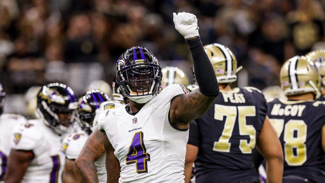 Nov 7, 2022; New Orleans, Louisiana, USA; Baltimore Ravens linebacker Jason Pierre-Paul (4) signals a 4th down stop against the New Orleans Saints during the first half at Caesars Superdome. Mandatory Credit: Stephen Lew-USA TODAY Sports