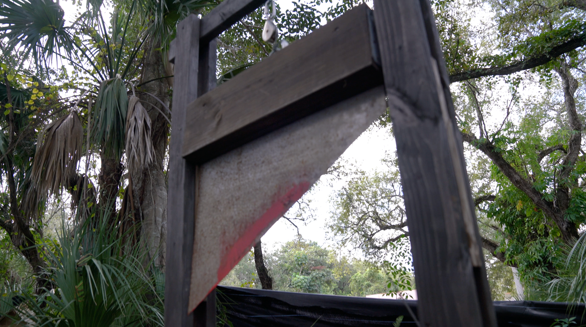 A fake guillotine at a Halloween haunted house at the Miami-Dade Kendall District police station.