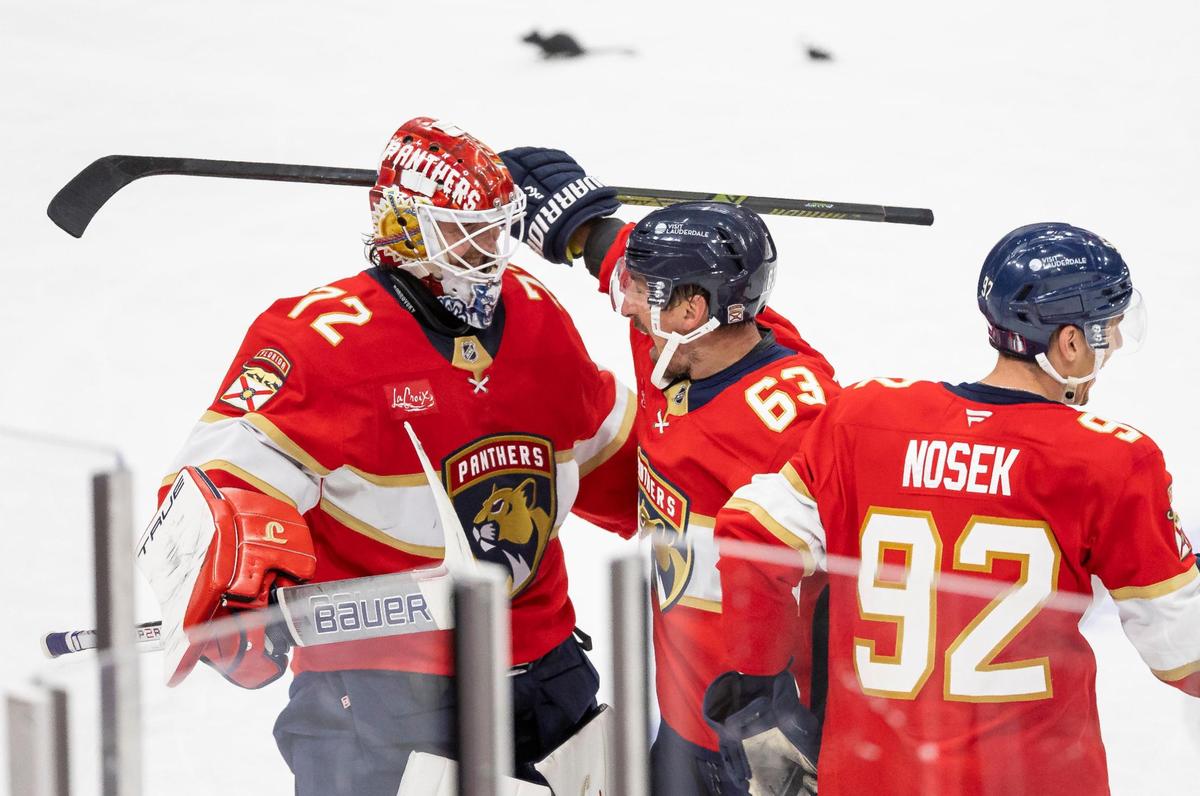 Florida Panthers center Brad Marchand (63) celebrates with goaltender Sergei Bobrovsky (72) and left wing Tomas Nosek (92) after scoring a goal against Toronto Maple Leafs goaltender Joseph Woll (60) in a Overtime period of Game 3 of a second-round Stanley Cup playoffs series at the Amerant Bank Arena on Friday, May 9, 2025, in Sunrise, Fla.