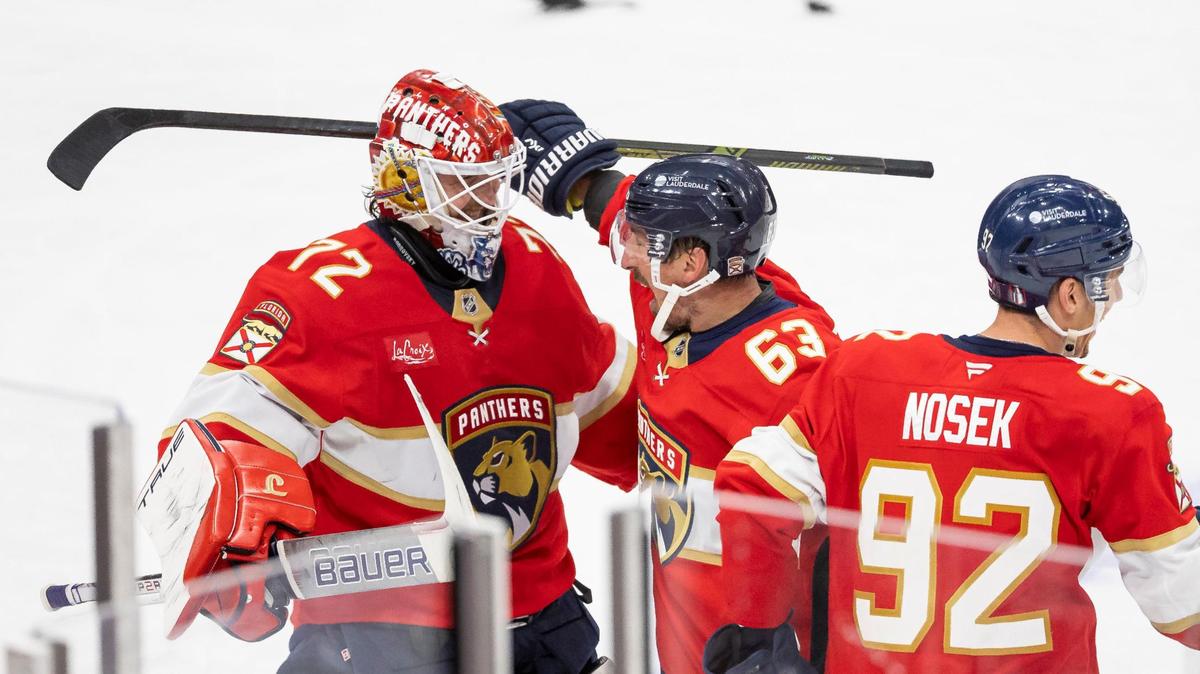 Florida Panthers center Brad Marchand (63) celebrates with goaltender Sergei Bobrovsky (72) and left wing Tomas Nosek (92) after scoring a goal against Toronto Maple Leafs goaltender Joseph Woll (60) in a Overtime period of Game 3 of a second-round Stanley Cup playoffs series at the Amerant Bank Arena on Friday, May 9, 2025, in Sunrise, Fla.