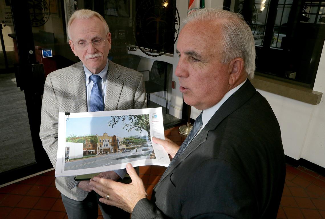 Mayor Carlos Gimenez (right) and Michael Spring, director of the Miami-Dade County Department of Cultural Affairs, talked about their last-minute meeting with Miami Mayor Francis Suarez on their position on rebuilding the Coconut Grove Playhouse Friday.