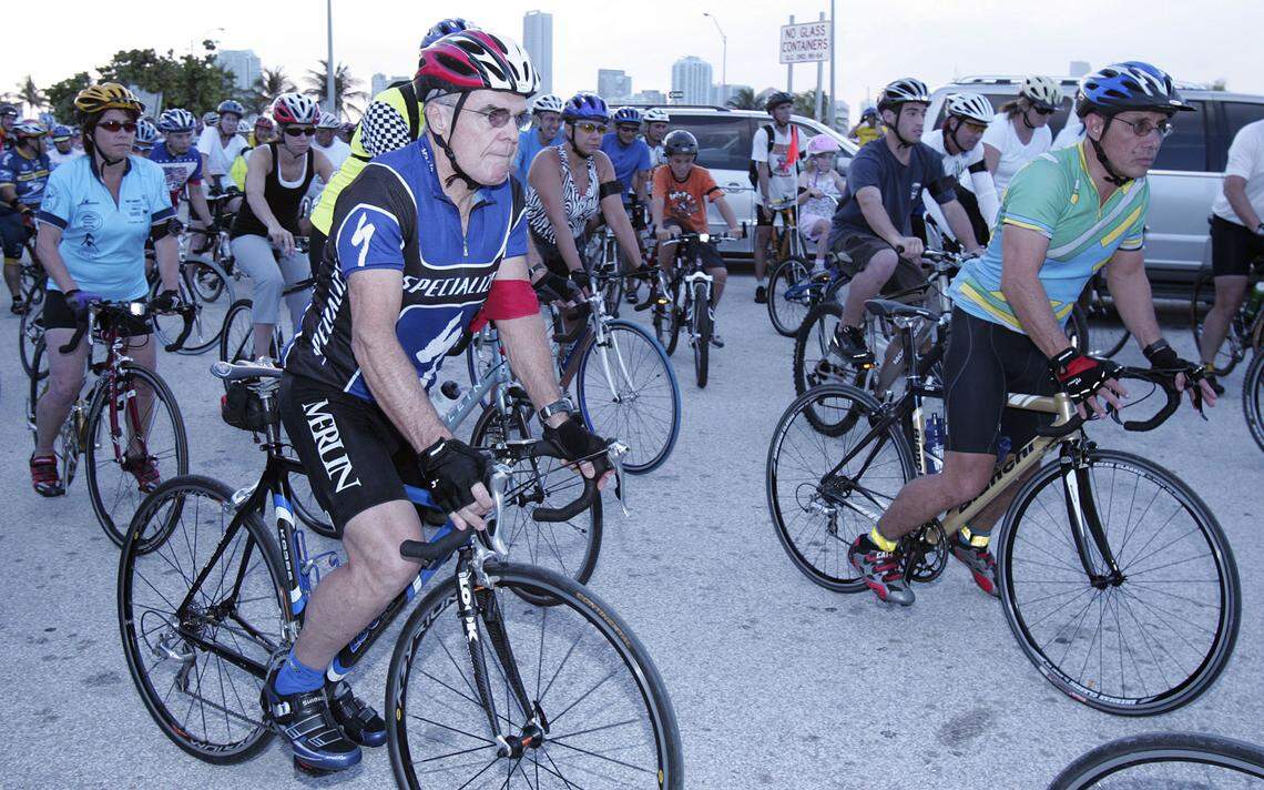 John Rothchild wears a red armband to signify that he was hit by a motorist while cycling as he participates in the Ride of Silence on Key Biscayne. 