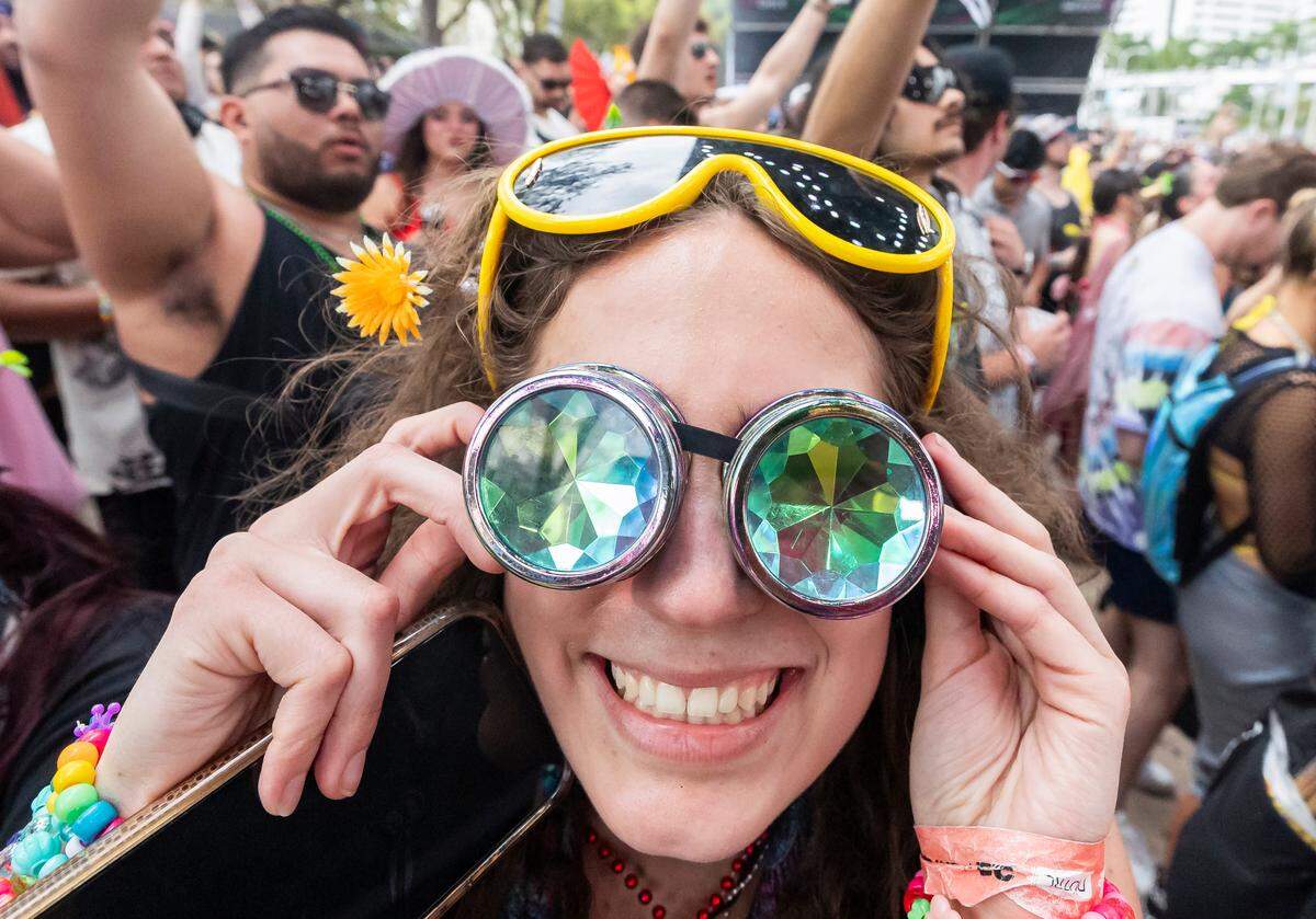 Isabella Martino holds her glasses during Ultra Music Festival’s 25th anniversary at Bayfront Park on Saturday, March 29, 2025, in downtown Miami, Fla.