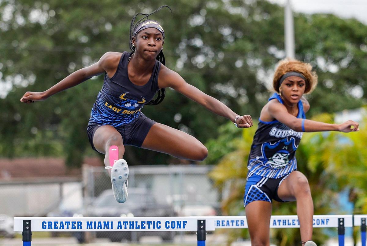 Miami Northwestern’s Lamia Green, and South Dade’s Jayla Anderson hurdle during GMAC Track and Field Finals at Traz Powell Stadium in Miami, Florida on Thursday, April 10, 2025.
