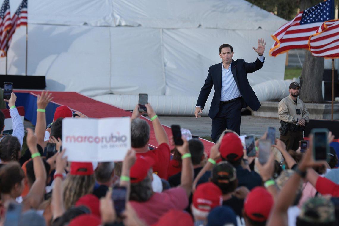 U.S. Sen. Marco Rubio waves to the crowd as he walks on stage to give his remarks at the Miami-Dade County Fair and Exposition on Sunday, November 6, 2022. Former President Donald Trump and a collection of other national and local Republicans campaigned with Rubio on the eve of the Nov. 8 election.