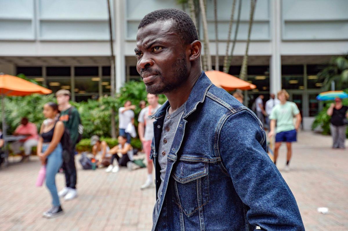 University of Miami student Nana Asamoah, 29, listens to speakers as the UM faculty hold a teach-in to raise awareness about Florida House Bill 999 and Florida Senate Bill 266., both of which would impact the state’s 12 public universities and colleges.
