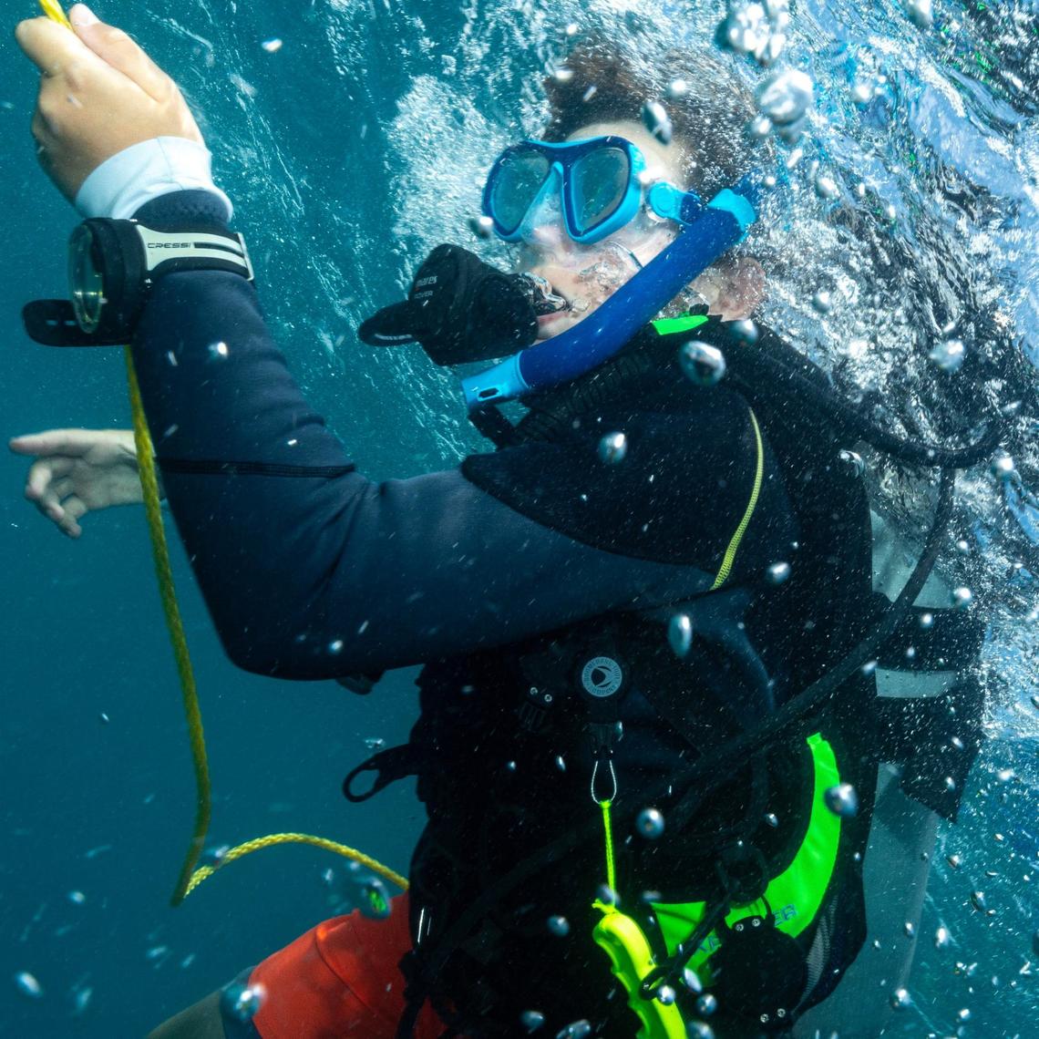 Master diver Matteo Miller, 12, makes his way to the downline during a ocean dive session on Thursday, August 8, 2024, in Key Biscayne, Fla. Miller received the Master Diver certification after completing his Rescue diver certification.