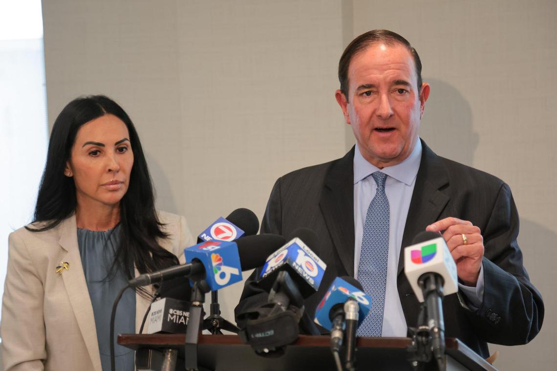 Attorney Michael Haggard, who represents Christine Maron, left, speaks to reporters during a press conference at The Haggard Law Firm in Coral Gables, Florida, on Monday, June 23, 2025. Maron is the mother of Dominic Ferrell, the 17-year-old boy stabbed to death while he was sleeping in a Brickell condo.