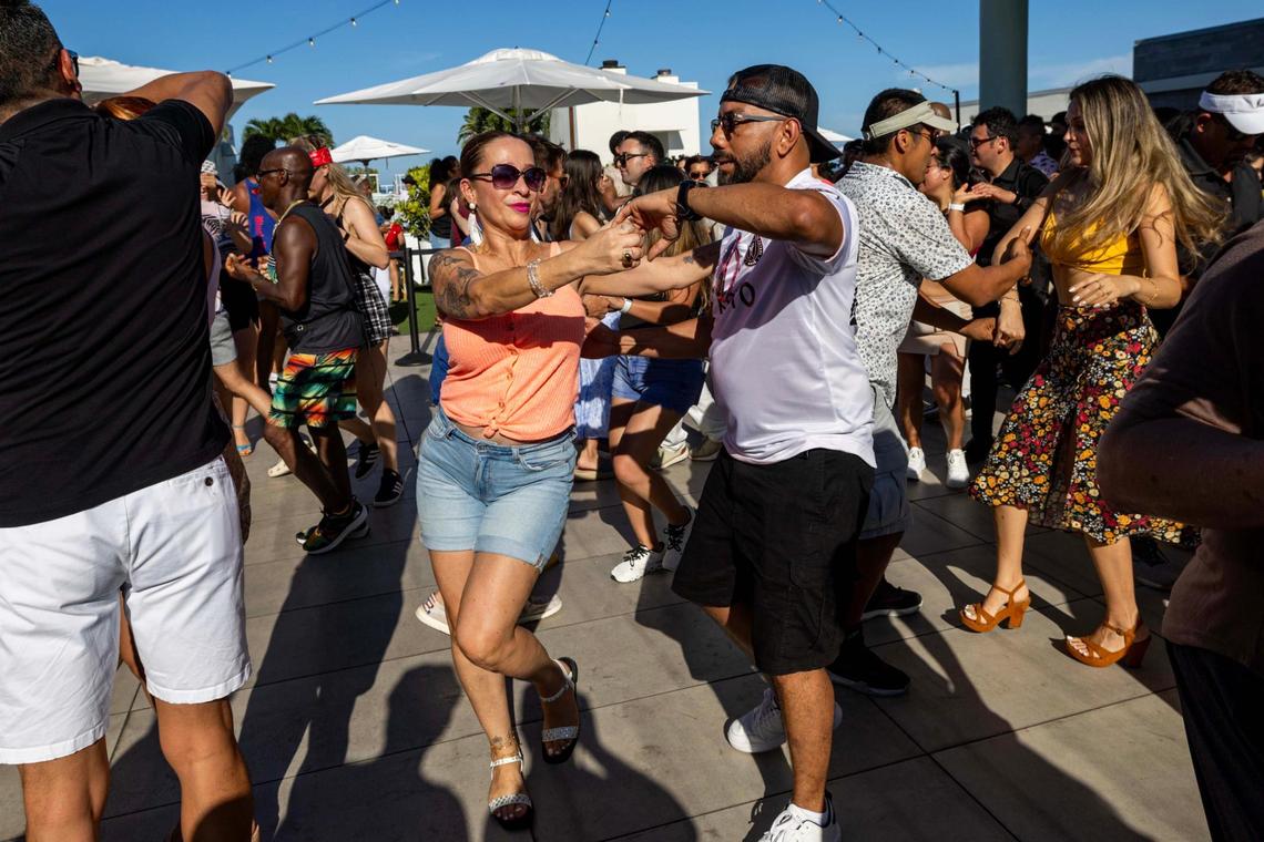 A man and woman dance salsa at Sunset Club Rooftop Restaurant and Lounge in Hollywood.