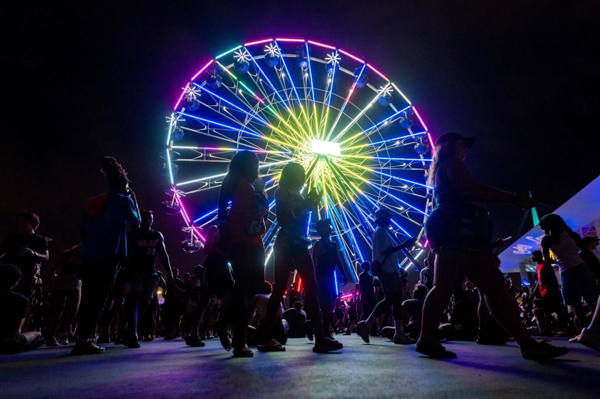 Attendees walk the festival grounds during day two of Rolling Loud Miami 2023 at Hard Rock Stadium in Miami Gardens, Florida, on Saturday, July 22, 2023.