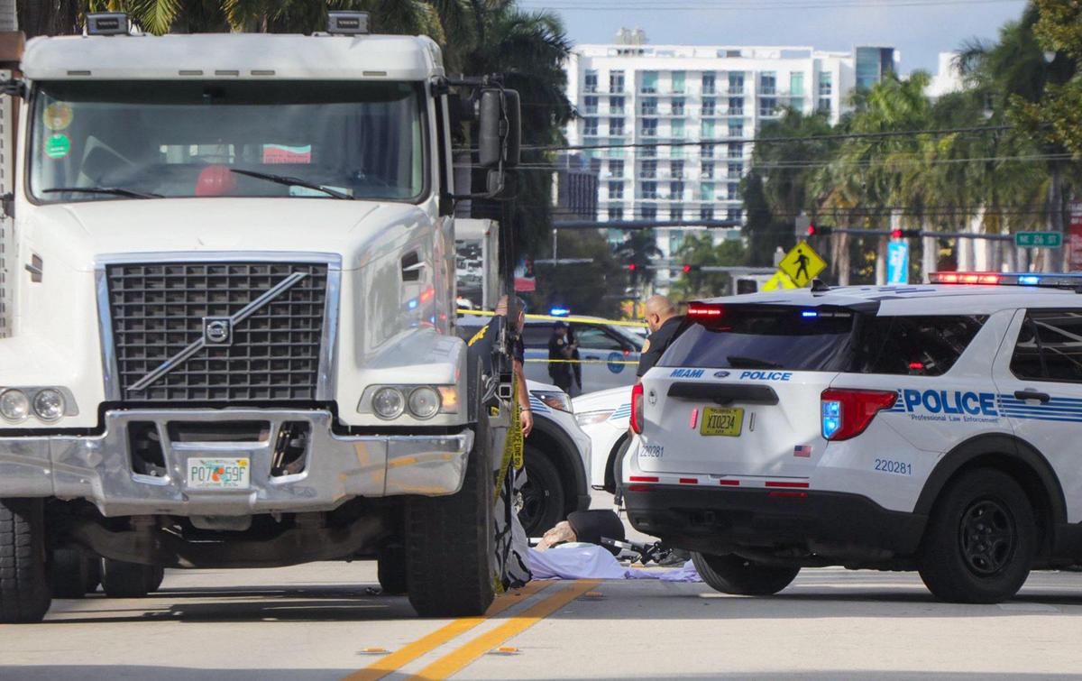 A woman pushing a baby in a stroller across Biscayne Boulevard was killed after being pinned under a dump truck on Feb. 14, 2024, Miami police said.
