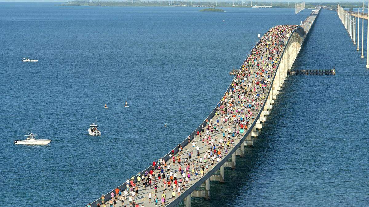 A portion of the field of 1,500 competitors run across the convergence of the Atlantic Ocean and Gulf of Mexico during the Seven Mile Bridge Run Saturday, April 18, 2015, near Marathon. The annual event is scheduled to take place Saturday, April 1, 2023.