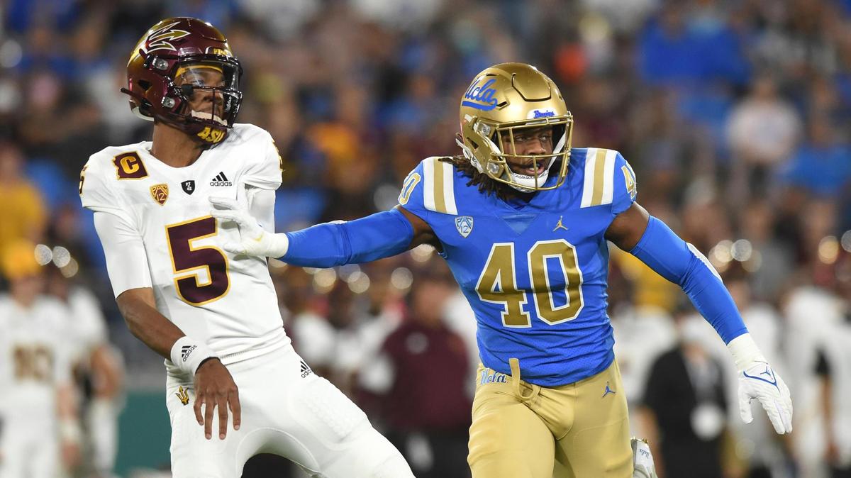 PASADENA, CA - OCTOBER 02: UCLA Bruins linebacker Caleb Johnson (40) puts pressure on Arizona State quarterback Jayden Daniels (5) during a college football game between the Arizona State Sun Devils and the UCLA Bruins on October 02, 2021, at the Rose Bowl in Pasadena, CA. (Photo by Chris Williams/Icon Sportswire) (Icon Sportswire via AP Images)