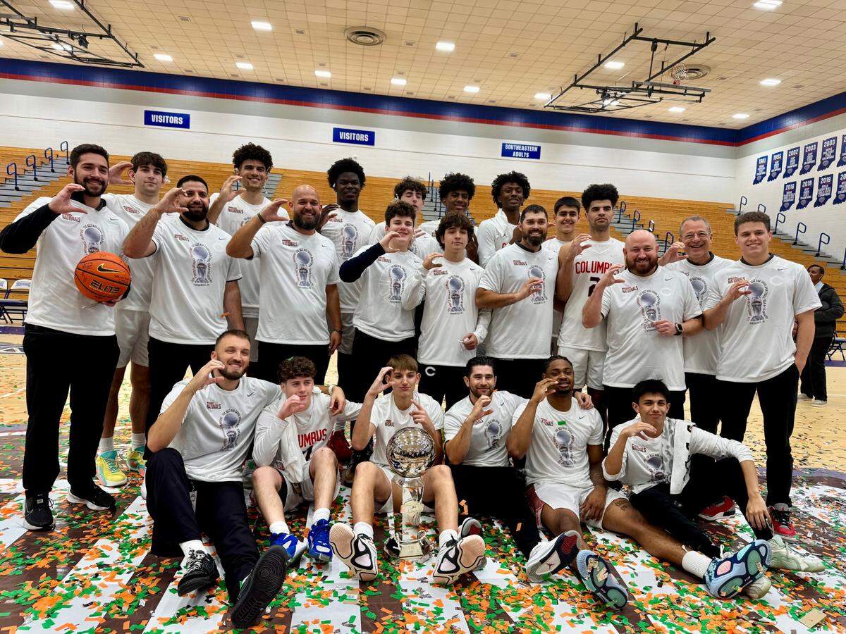 Columbus’ basketball team celebrates after winning the Chipotle Nationals tournament on Saturday in Fishers, Indiana.