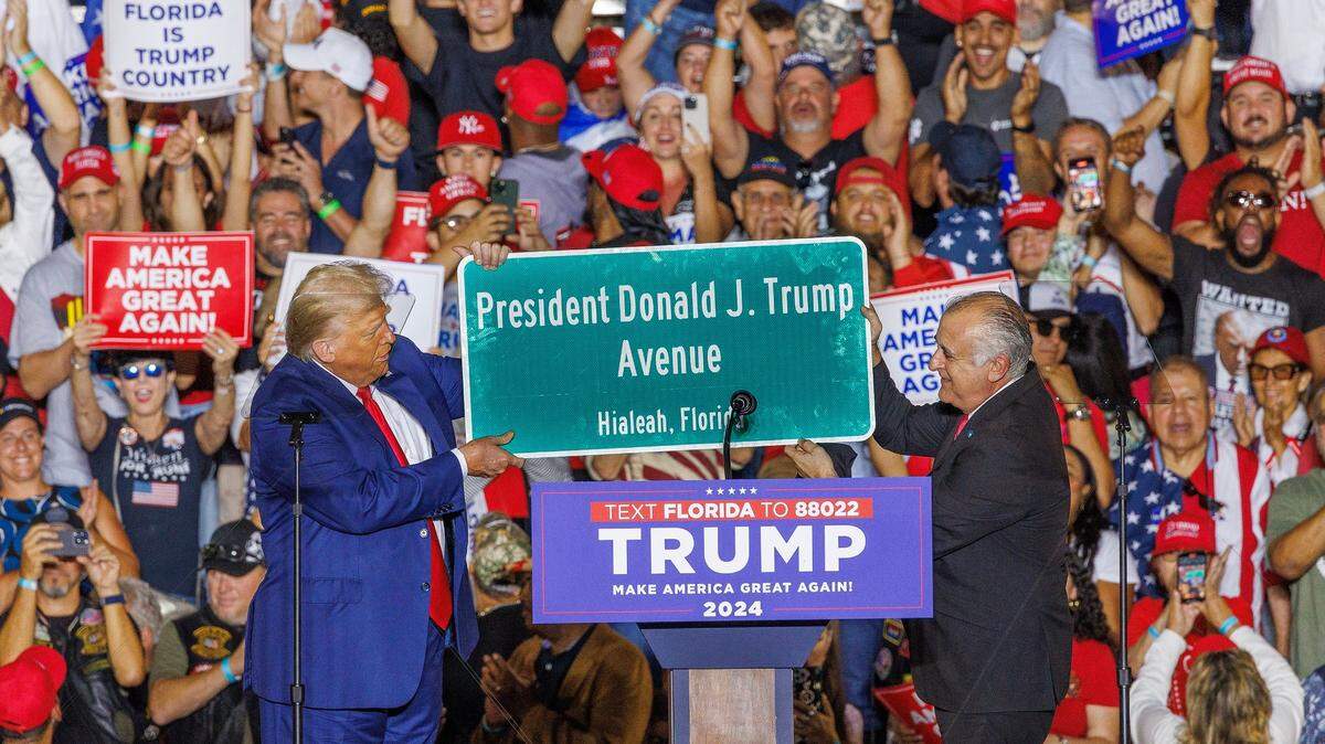 City of Hialeah Mayor Esteban Bovo, Jr. presented a street sign bearing the name of former President Donald Trump after his announcement of his proposal to the city council to named a Hialeah street in his name during a full house rally at the Ted Hendricks Stadium at Henry Milander Park in Hialeah, on Wednesday, November 08, 2023.