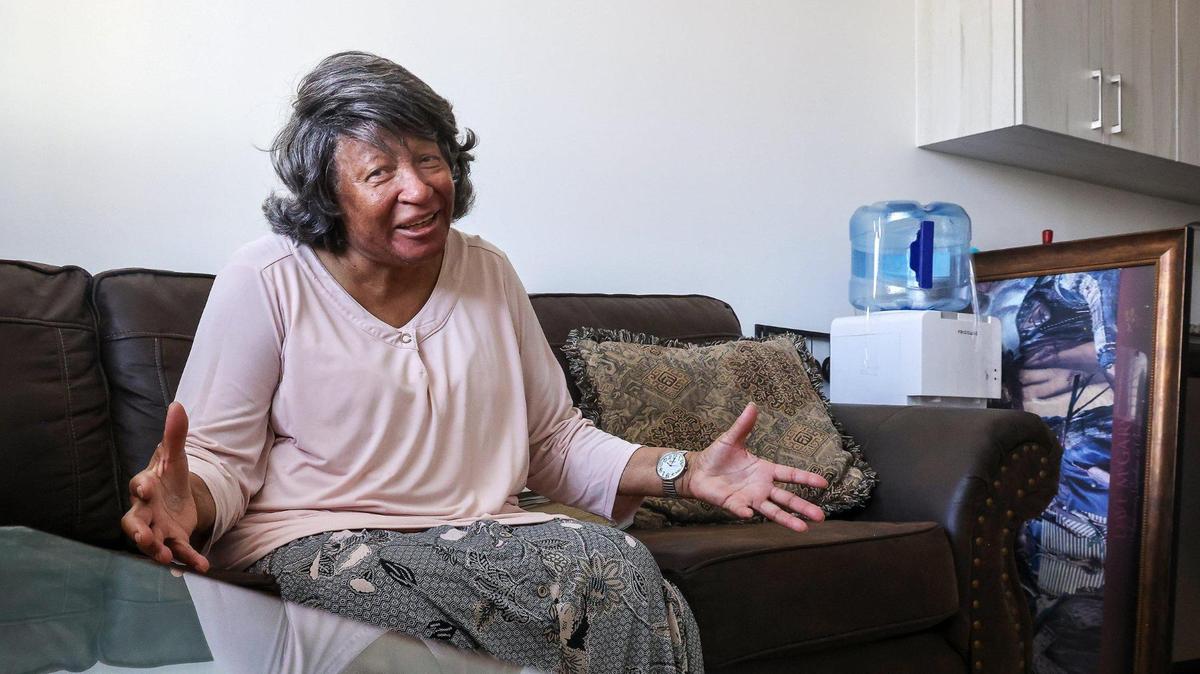Seventy-four-year-old Minnie Davis expresses her delight in having a larger stove for Thanksgiving dinner since moving into her one-bedroom apartment at Serenity of Liberty Square. Serenity of Liberty Square hosted a ribbon-cutting ceremony to mark the opening of phase four in a nine-phase redevelopment project. The event featured notable attendees, including Scott Turner, Secretary of the U.S. Department of Housing and Urban Development, and Miami-Dade County Mayor Daniela Levine Cava, alongside representatives from Related Group on Thursday, April 10, 2025, in Miami, Florida.