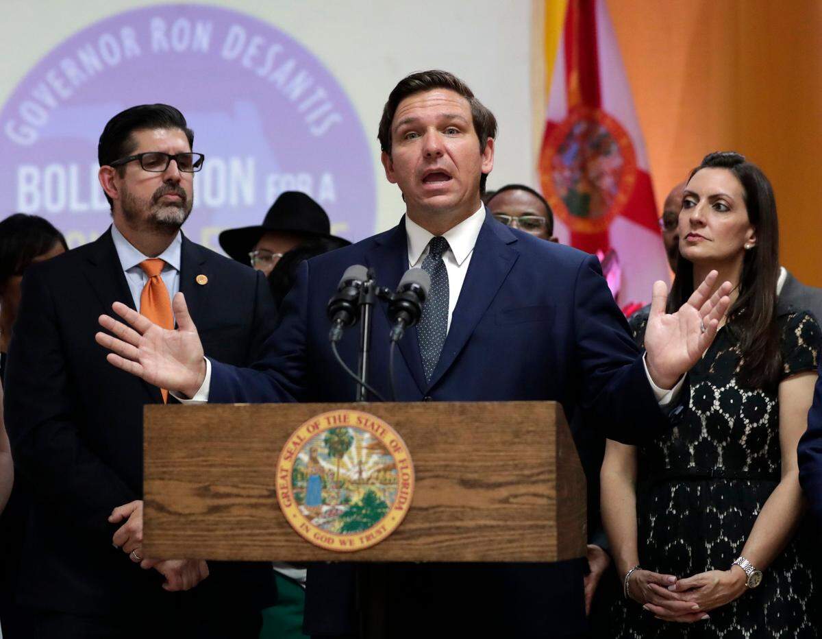 Florida Gov. Ron DeSantis speaks during a bill-signing ceremony at the William J. Kirlew Junior Academy, in Miami Gardens in May 2019.
