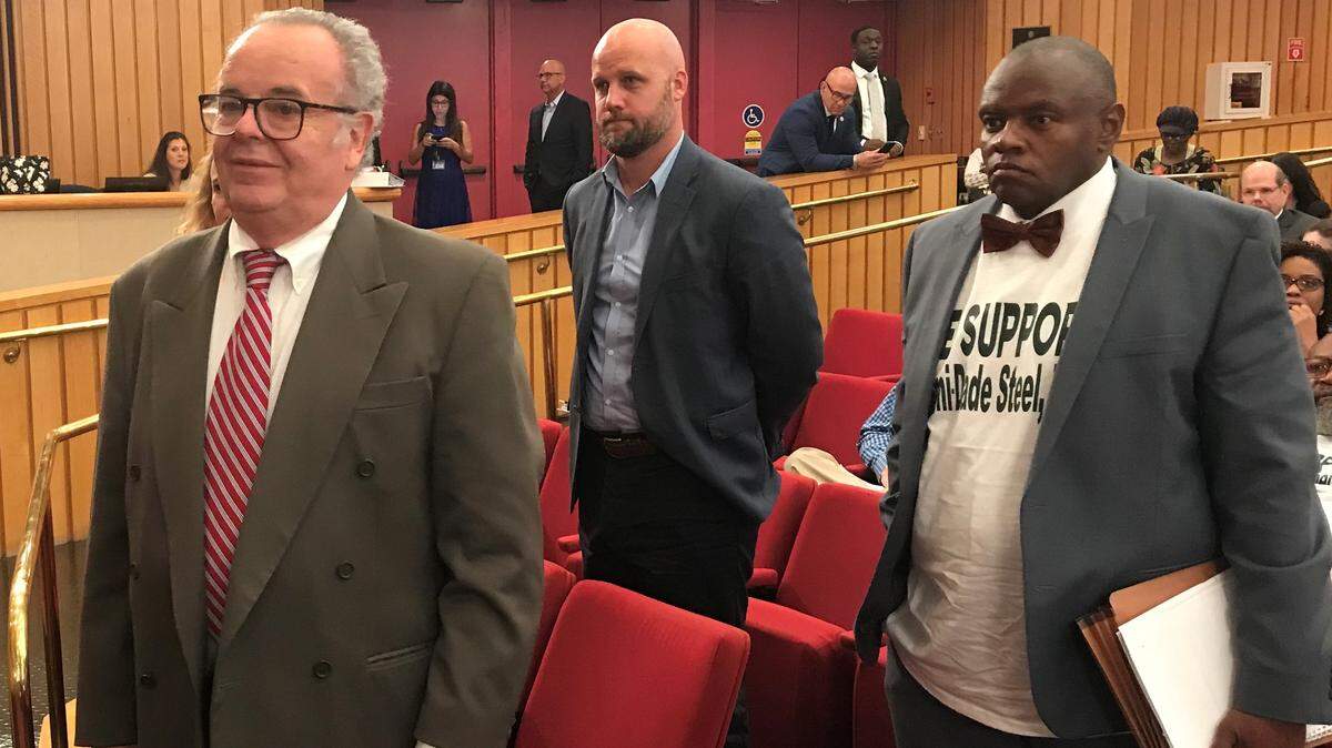 Partners in Miami-Dade Steel, a planned “micro” steel mill powered by electricity near Homestead: Gustavo Lopez, left, Julio Gimenez, center, and Leroy Jones, right. They were photographed in the Miami-Dade Commission Chambers after a May 7, 2019, vote to approve selling a parcel of county land for an electric steel mill the partners want to build near the Homestead air base. Gimenez is the son of Mayor Carlos Gimenez, who recused himself in 2017 from decisions on his son’s venture.