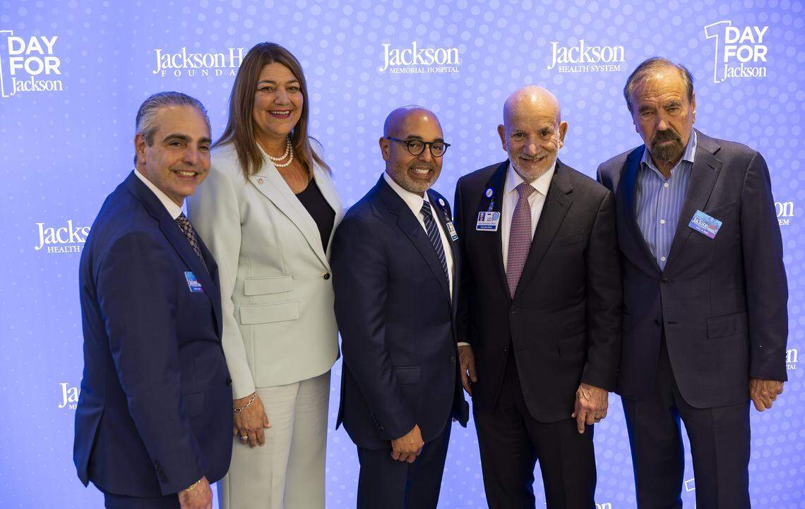 From left to right: Albert Milo, Jr., president of Related Urban Development Group, Madeline Pumariega, president of Miami Dade College, David Zambrana, incoming Jackson Health System chief executive officer, Carlos Migoya, outgoing Jackson Health System chief executive officer, and Jorge Perez, chairman and chief executive officer of The Related Group, gather for a photo during a preview event of a new emergency room at Jackson Memorial Hospital on Thursday, April 16, 2026, in Miami, Fla.