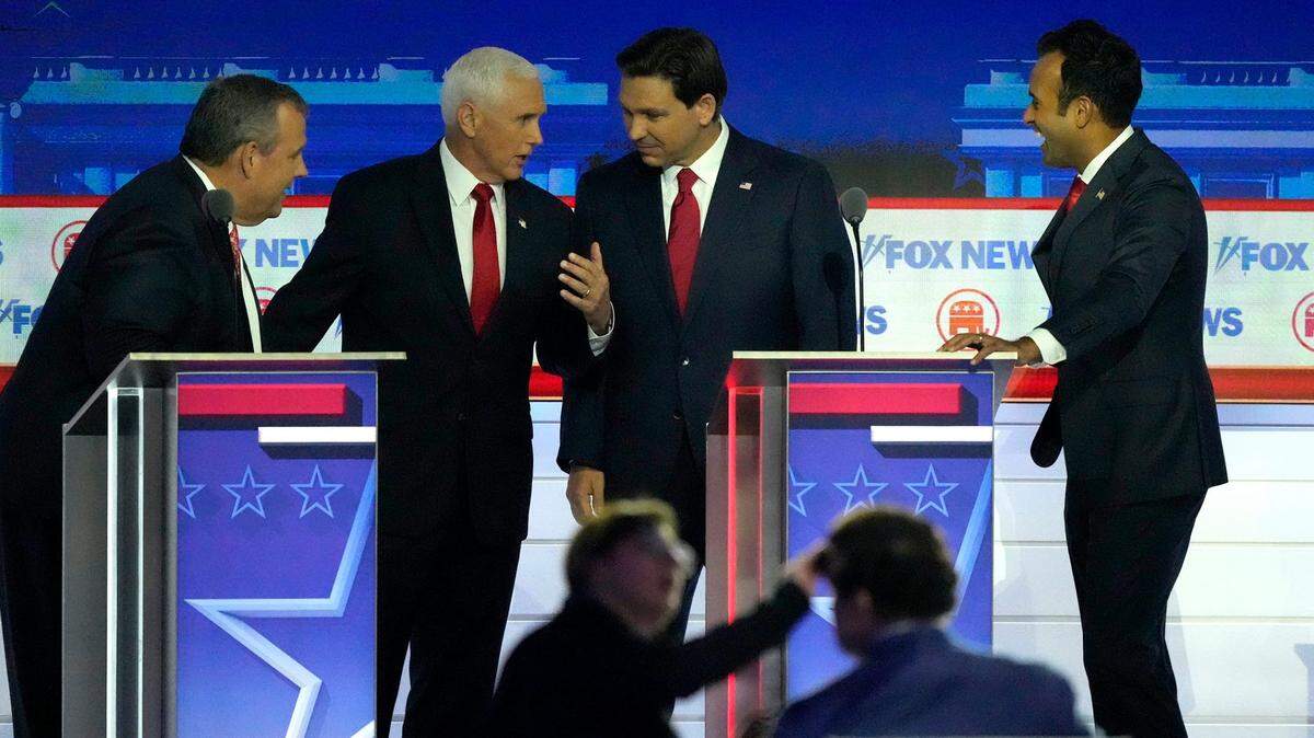 In the first debate for the GOP nomination, Republican presidential candidates talked on stage. From left, former New Jersey Gov. Chris Christie, former Vice President Mike Pence, Florida Gov. Ron DeSantis and entrepreneur Vivek Ramaswamy.
