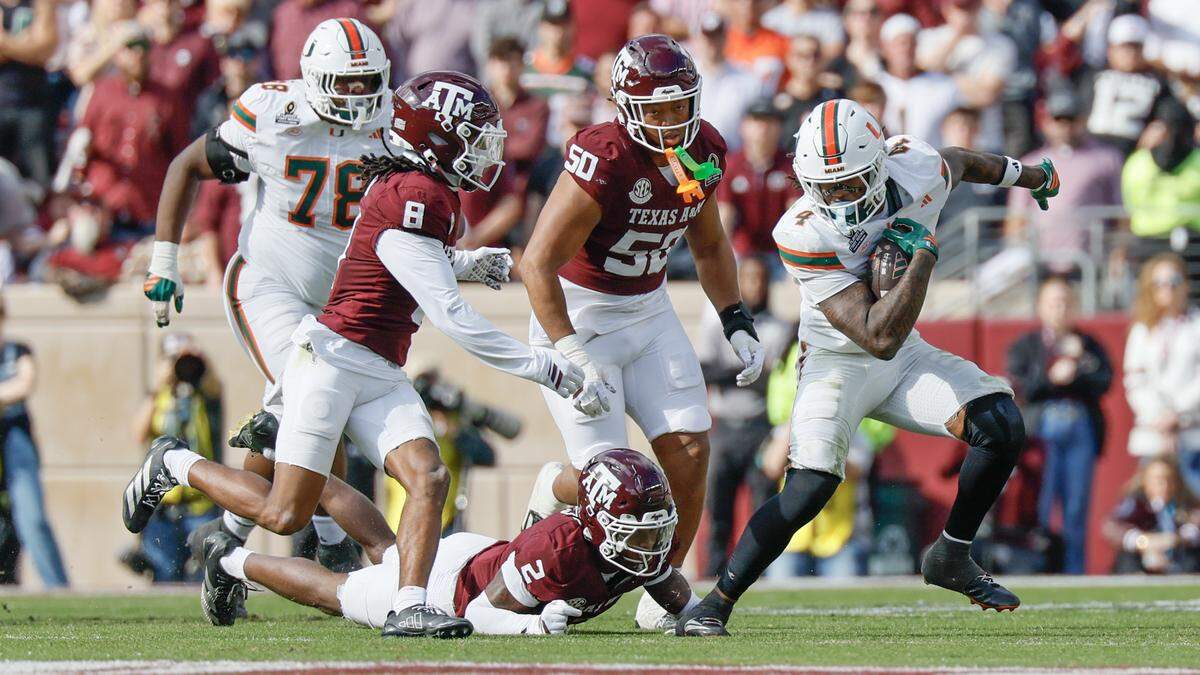 Miami Hurricanes running back Mark Fletcher Jr. (4) breaks an attempted tackle by Texas A&M Aggies cornerback Dezz Ricks (2) in the second half of the first round of the 2025 College Football Playoff at Kyle Field at College Station, Texas, on Saturday, December 20, 2025.