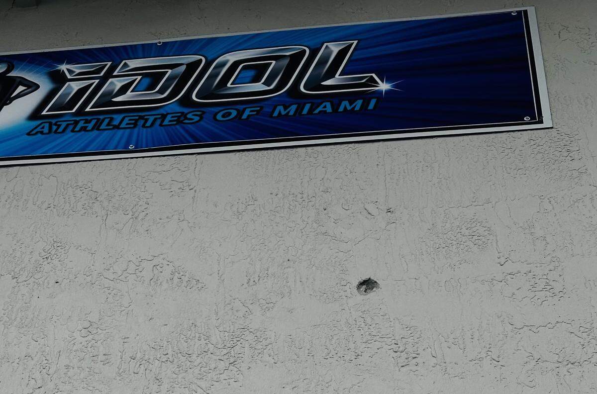 A bullet hole could be seen just under the Idol Cheer sign, a cheerleading training camp near where the shootout occurred.