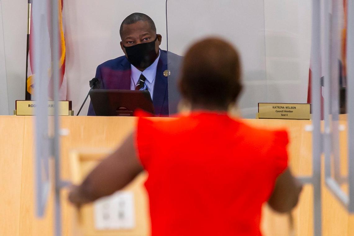 Miami Gardens Mayor Rodney Harris listens to former Miami Gardens Mayor Shirley Gibson speak during a city council meeting at the Shirley M. Gibson City Hall in Miami Gardens, Florida, on Wednesday, April 14, 2021.