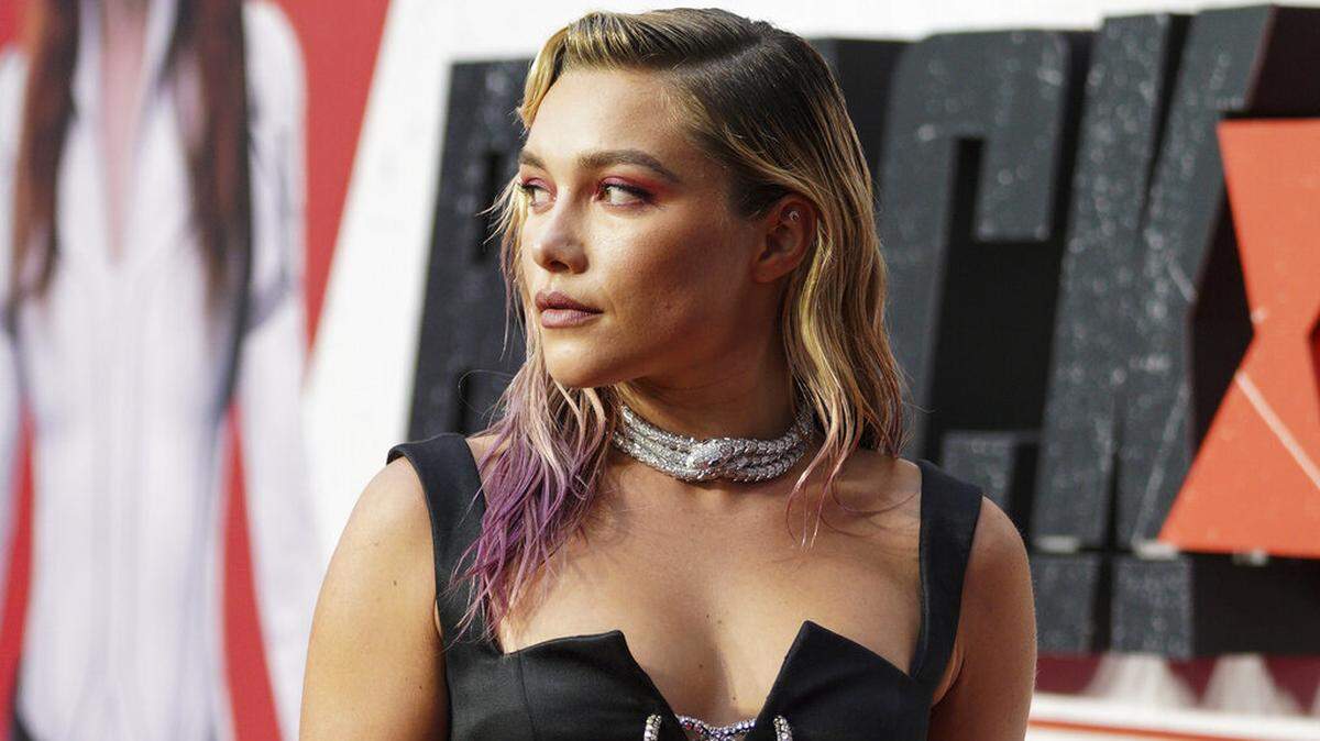Florence Pugh poses for photographers upon arrival at a fan event for the film Black Widow in London, Tuesday, June 29, 2021.