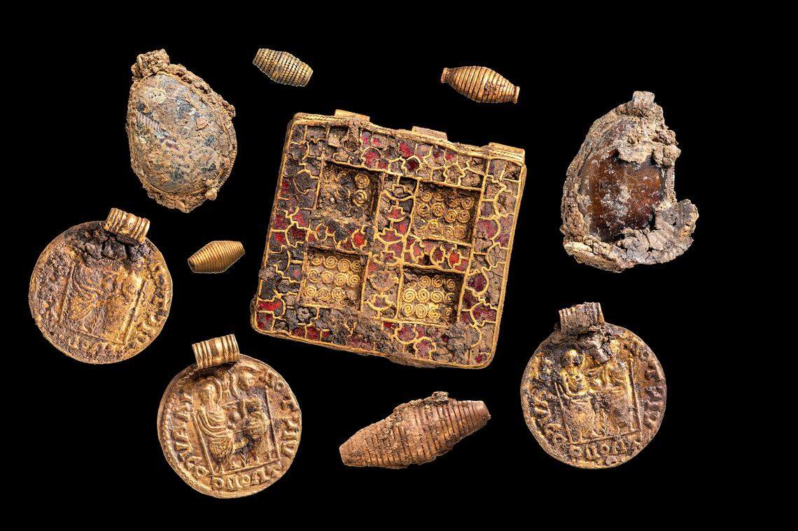 Some of the necklace pendants found in the medieval woman’s grave.