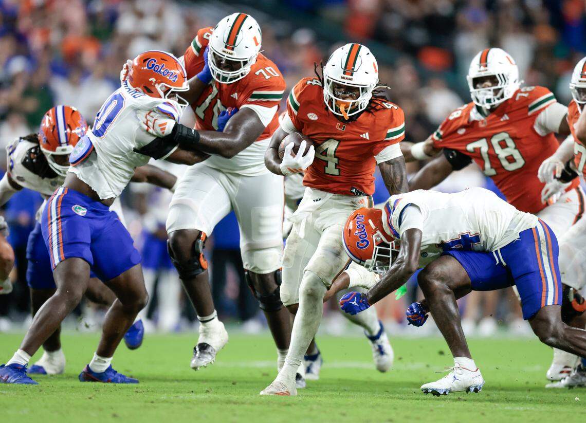 Miami Hurricanes running back Mark Fletcher Jr. (4) on a carry against the Florida Gators in the second half of their NCAA football game at Hard Rock Stadium in Miami Gardens, Florida, on Saturday, September 20, 2025.