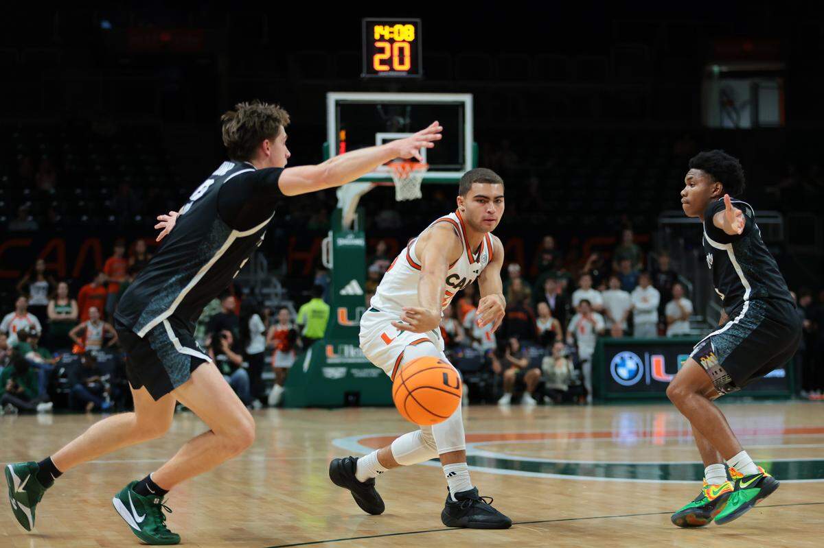 Miami Hurricanes guard Dante Allen (35) passes the basket against the Stetson Hatters during the first half at Watsco Center in Coral Gables, Florida, on Monday, Nov. 10, 2025.