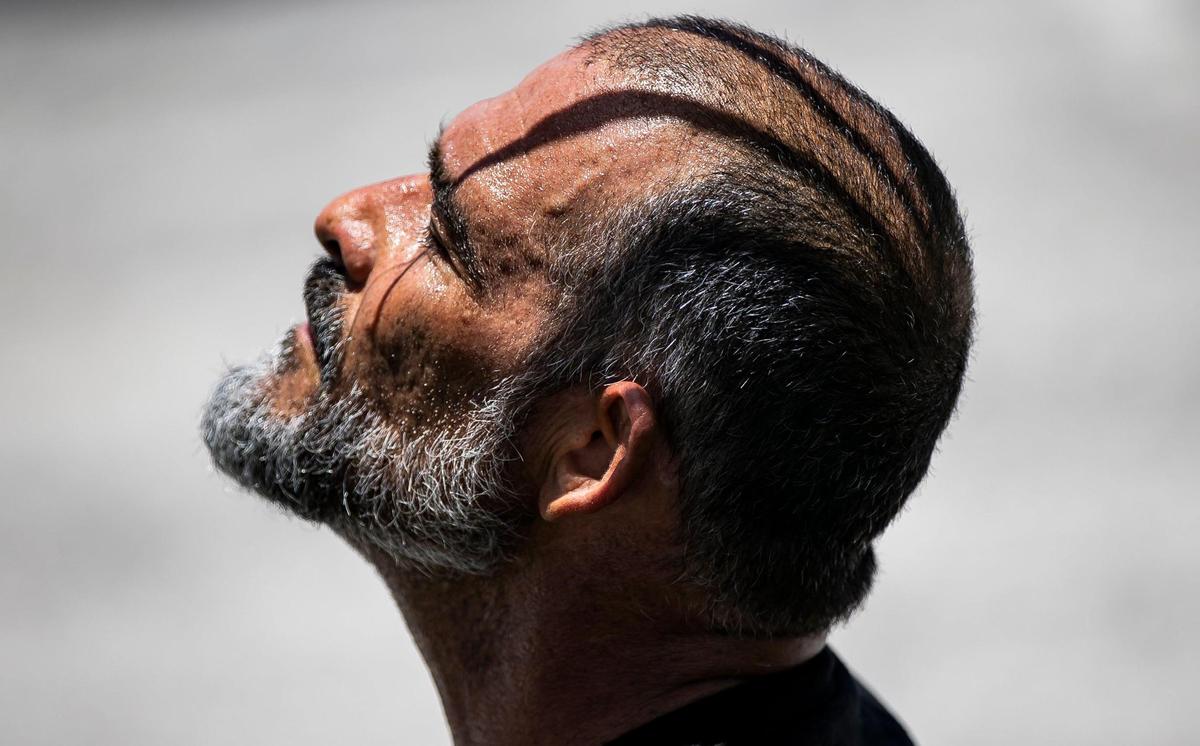 Beads of sweat gather on Orlando Castro, 53, as he takes a moment to rest after riding his bike at Haulover Skateboard Park on Wednesday, June 14, 2023, in Miami Beach, Fla. Miami-Dade County issued a heat advisory for residents after the National Weather Service estimated the heat index would reach between 105 and 108 degrees.