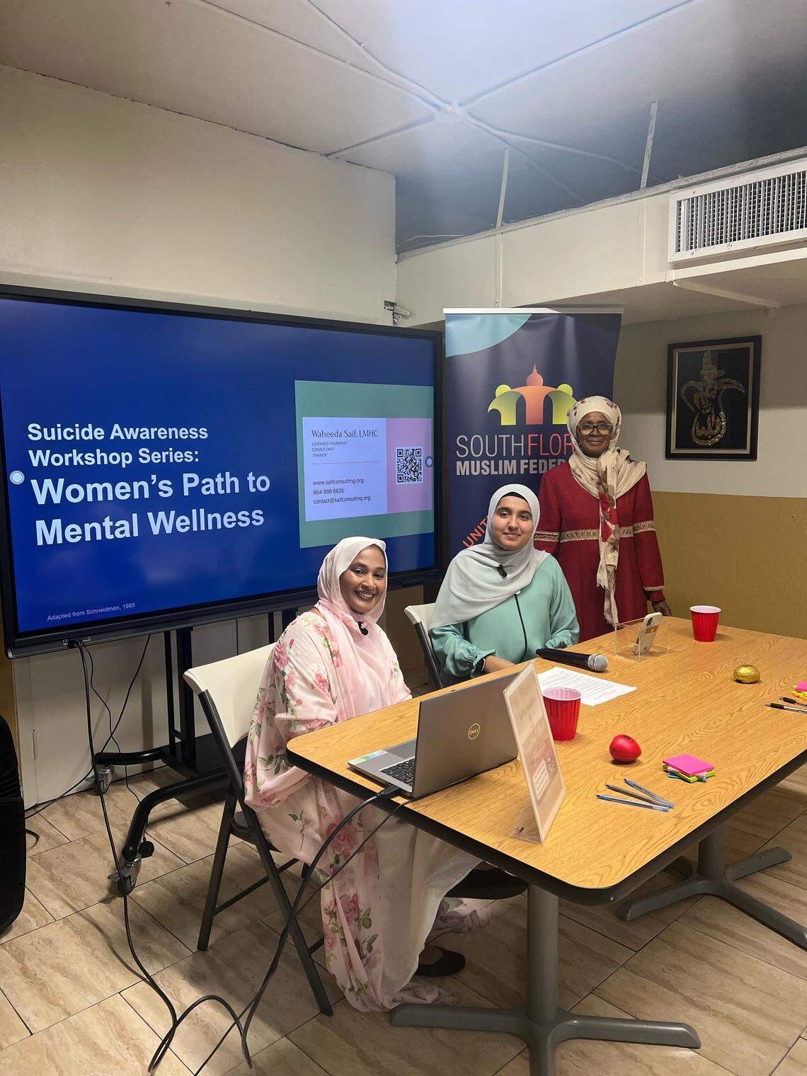 Women in the Muslim community pose for a photo at a recent mental health workshop focused on women’s mental health at Masjid Al-Ansar, a mosque in Liberty City.