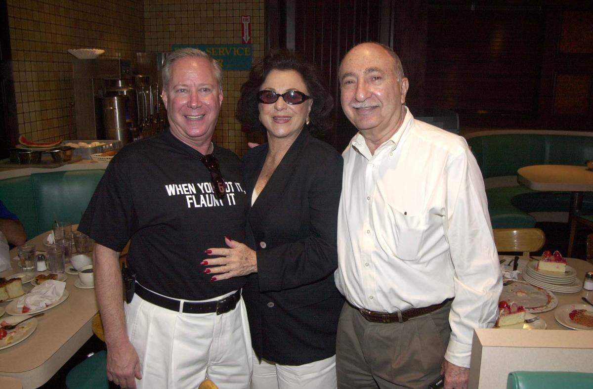 Three personalities who helped make Miami Beach a landmark area for the arts and culture: tourism director Michael Aller, left, concert impressaria Judy Drucker, who brought Pavarotti to the Beach for a concert on the sands, and press agent Charlie Cinnamon, gathered together at Rascal House on Sept. 16, 2001.