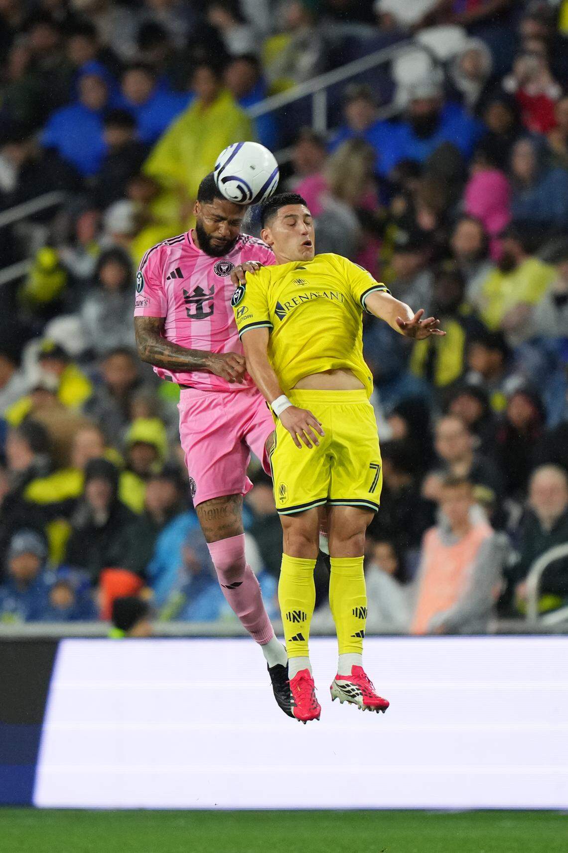 NASHVILLE, TENNESSEE - MARCH 11: Micael #16 of Inter Miami CF and Cristian Espinoza #7 of Nashville SC compete for a header during the CONCACAF Champions Cup 2026 match between Nashville SC and Inter Miami CF at GEODIS Park on March 11, 2026 in Nashville, Tennessee.  (Photo by Chris Carter/Getty Images)
