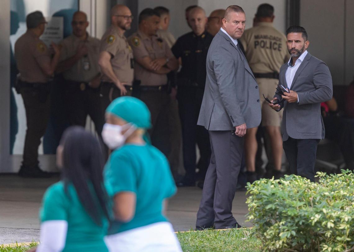 Police officers gather at Jackson Memorial Hospital’s Ryder Trauma Center on Friday, Nov. 4, 2022, in downtown Miami, Fla. Police say an off-duty officer was rushed to the hospital after his ex-girlfriend shot him in the head during a domestic dispute Friday morning in Hialeah.