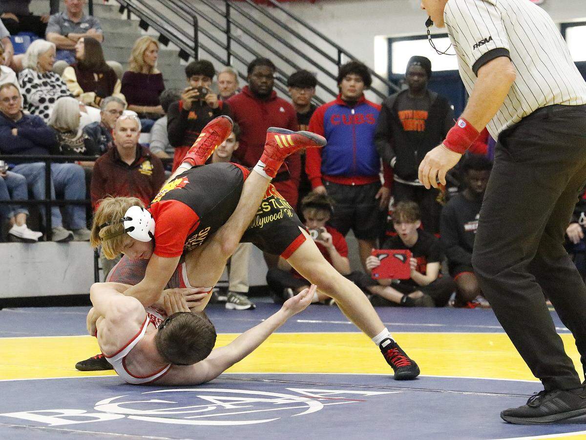 Illia Kyryianenko (on top) of South Broward HS wrestlers Skyler Barreto of Cardinal Gibbons HS in the 138-pound championship match at the BCAA Wrestling Championships on Saturday, February 7, 2026 at Dillard HS in Fort Lauderdale. Andrew Uloza / for Miami Herald. Illia Kyryianenko won the match.
