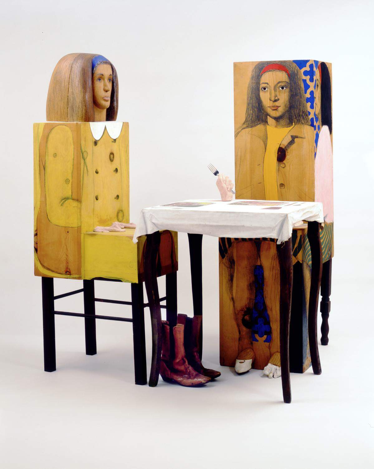 “Dinner Date” by Marisol made in 1963. Journalists often asked Marisol why she was not married with children. This double self-portrait depicts Marisol having dinner with herself. The work is interpreted to be Marisol’s response to those questions.