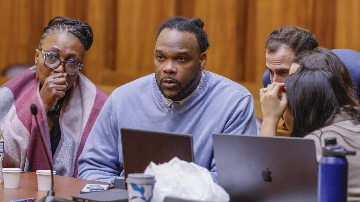 Rashaun Jones, who is accused of killing his University of Miami football teammate Bryan Pata in 2006, sits with defense attorneys in Judge Cristina Miranda Courtroom 4-1 at the Richard E. Gerstein Justice Building in Miami, FL, on Thursday, February 26, 2026.