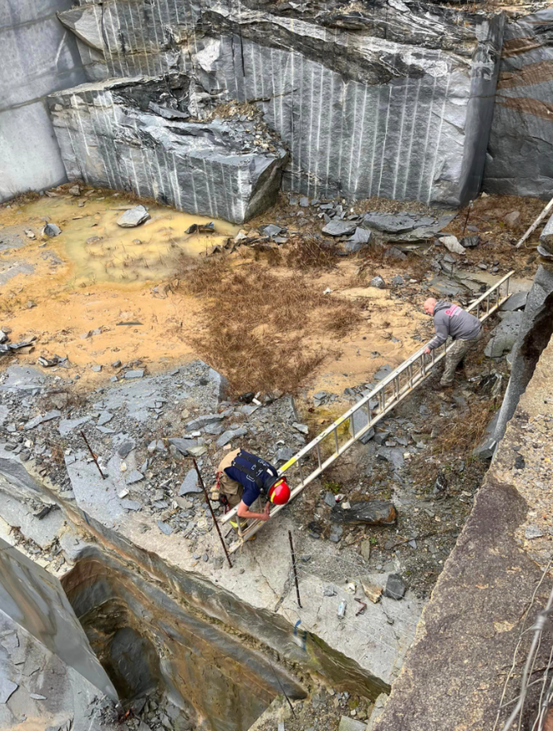 Rescuers had to use ropes and ladders to scale down the quarry, officials said.