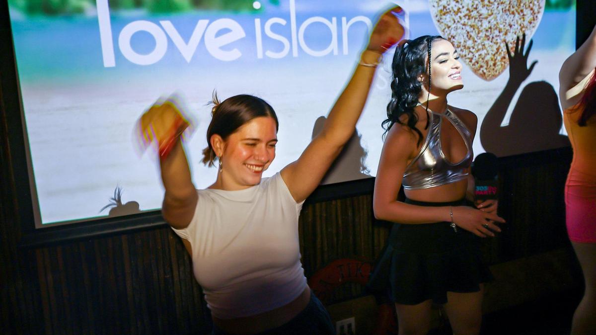 Raysa Rey, 25, left, reacts to the crowd during commercial break contest as The Dead Flamingo hosted a watch party of the popular show “Love Island USA” which featured South Florida contestants including the finalist Nicolas “Nic” Vansteenberghe, a FAU student on Sunday, July 13, 2025, in Miami, Florida.