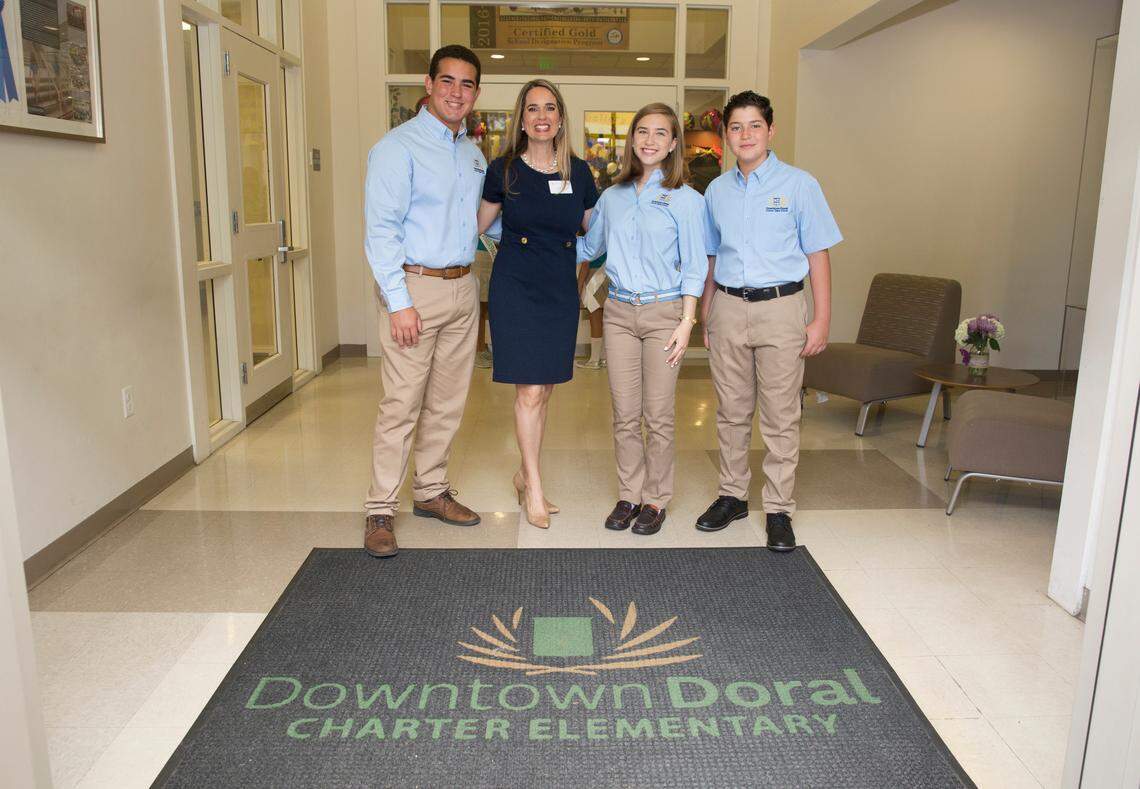 The Codina Partners, parents, students and teachers gathered at a groundbreaking ceremony to celebrate the new Downtown Doral Charter Upper School. Head of School Jeannette Acevedo-Isenberg is pictured with students from Downtown Doral Charter Elementary School dressed in the upper school uniform. The new school will welcome students for the 2019-20 school year.