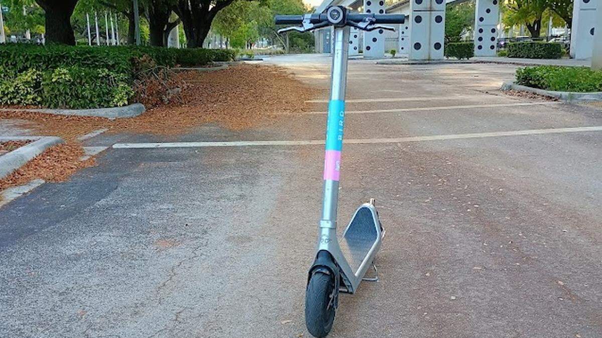 A Bird scooter blocks the street near UM — despite a campus-wide ban on shared services like Bird and Lime.