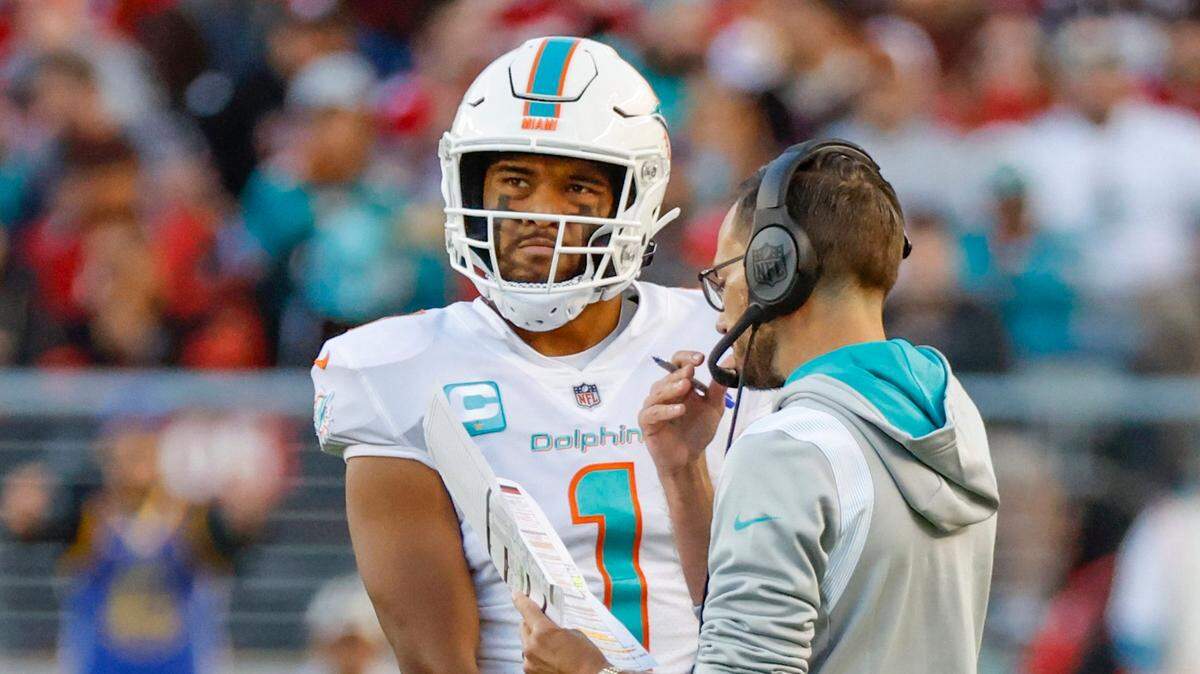 Miami Dolphins head coach Mike McDaniel speaks with quarterback Tua Tagovailoa (1) in the game’s final moments against the San Francisco 49ers at Levi’s Stadium in Santa Clara, California on Sunday, December 4, 2022.