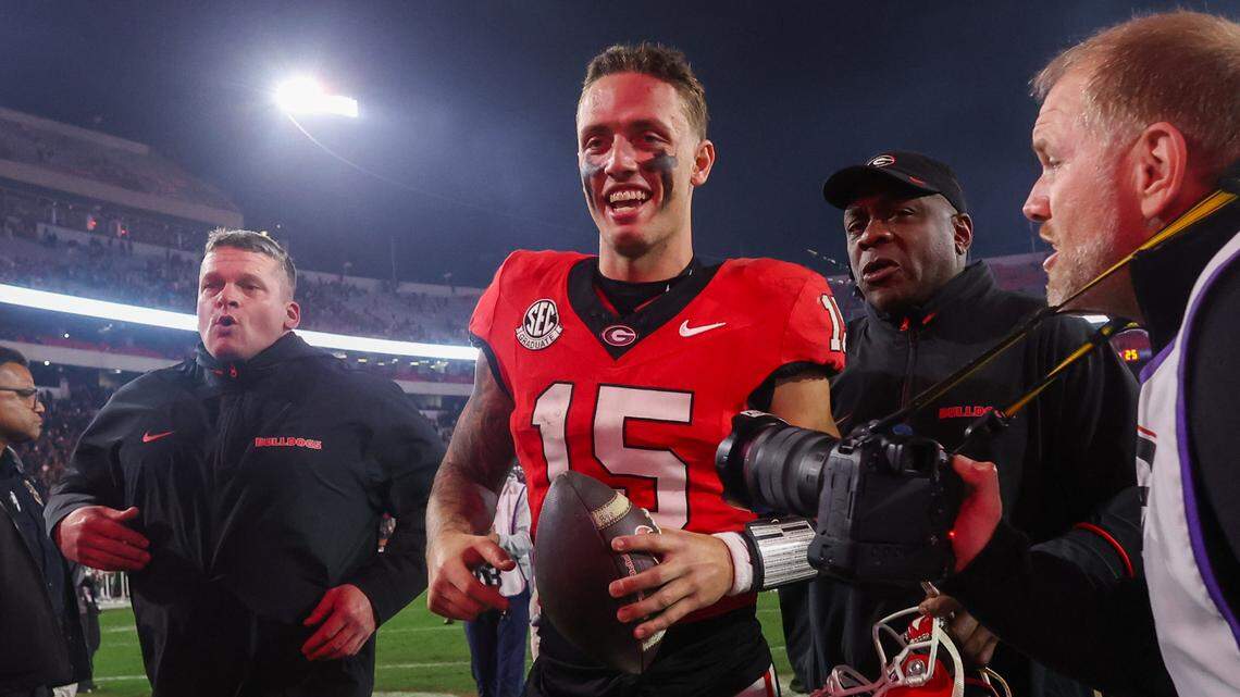 Nov 16, 2024; Athens, Georgia, USA; Georgia Bulldogs quarterback Carson Beck (15) celebrates after a victory over the Tennessee Volunteers at Sanford Stadium. Beck transferred to University of Miami in January 2025. Thieves stole three luxury cars from outside his South Florida home Thursday, Feb. 20, 2025, according to the Miami-Dade Sheriff’s Office.