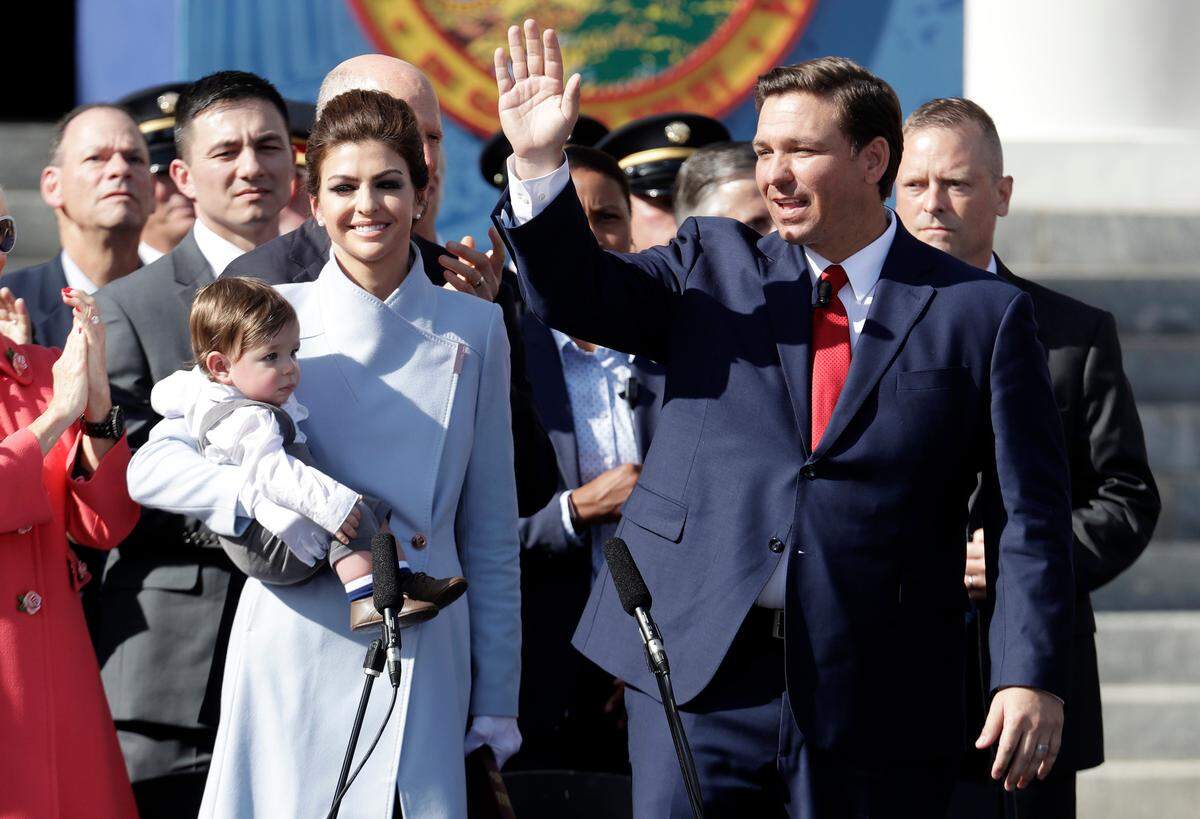 Florida Gov. Ron DeSantis, right, waves during an inauguration ceremony with his wife, Casey, and son, Mason, on Tuesday, Jan. 8, 2019, in Tallahassee. Republicans will begin their third decade dominating the state’s Capitol.