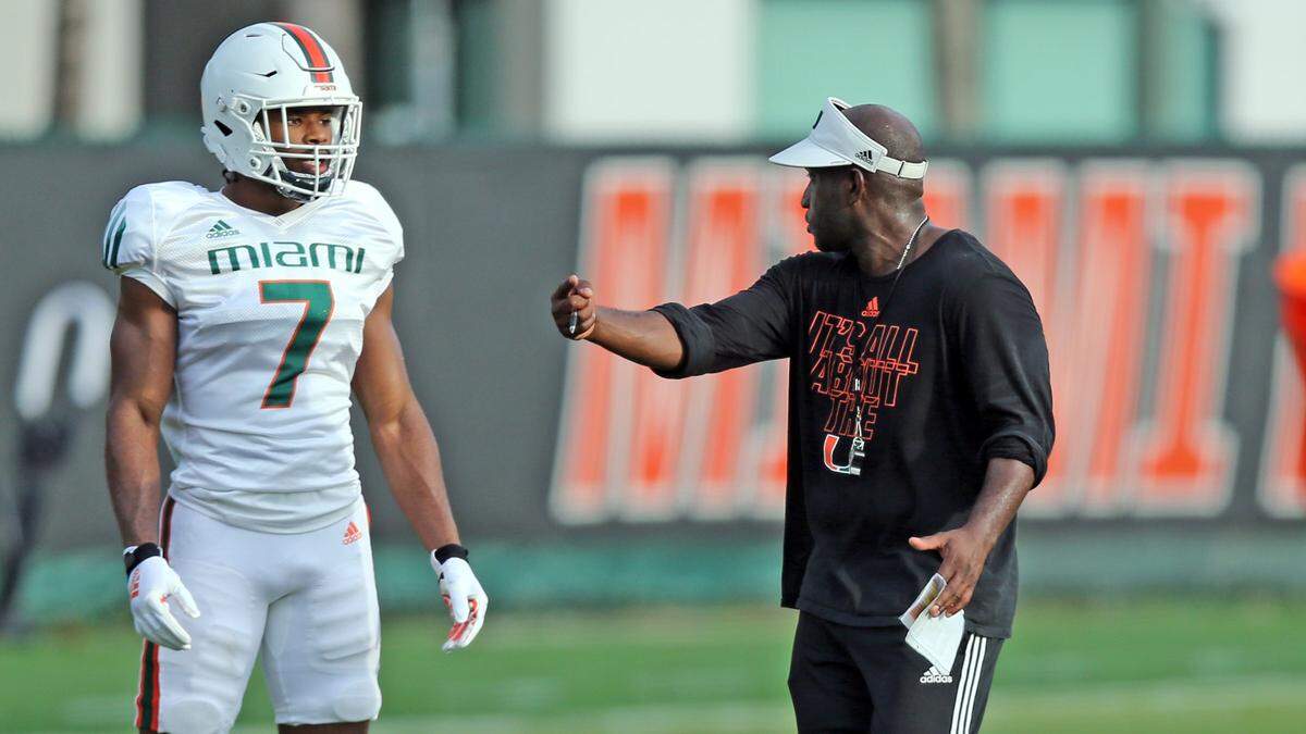 Miami Hurricanes cornerback Al Blades Jr. (7) interacts with defensive backs coach, Travaris Robinson, during practice at the University of Miamis Greentree Field in Coral Gables on Thursday, August 12, 2021.