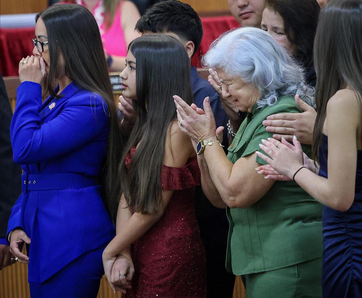 Former councilwoman Jacqueline García-Roves, left, gets emotional, along with her mother Tania Garcia-Roves, right, as the memory of her father is evoked during the swearing in ceremony as interim mayor of Hialeah, marking a historic milestone as she became the first woman to assume this position in the 100-year history of the city on Monday, April 28, 2025, in Hialeah’s City Hall.