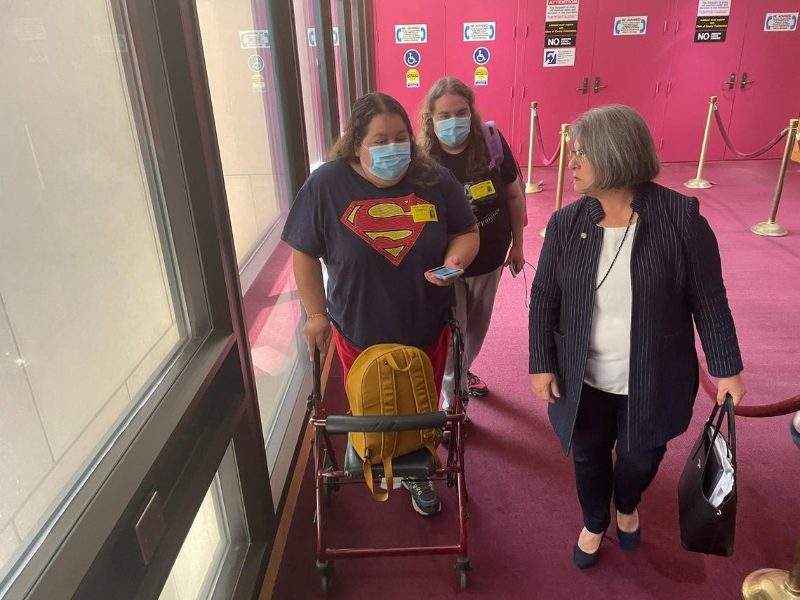Mercedes Cabrera, left, speaks with Miami-Dade County Mayor Daniella Levine Cava during a break in a County Commission meeting where a new Tenant’s Bill of Rights law was passed on Tuesday, May 3, 2022. Cabera wants help in an eviction proceeding in the Hialeah townhome where she lives with her family. In the background is Milagro Cabrera, Mercedes’ sister, who also lives in the Hialeah home.